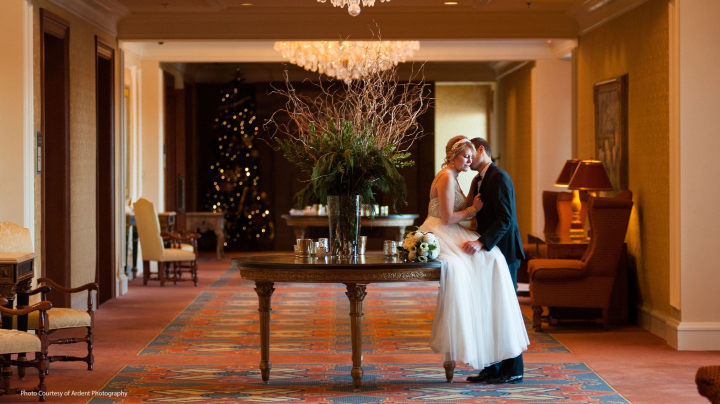 Bride and from posing for a photo in the elegant hallways at the Little America Hotel in Cheyenne.