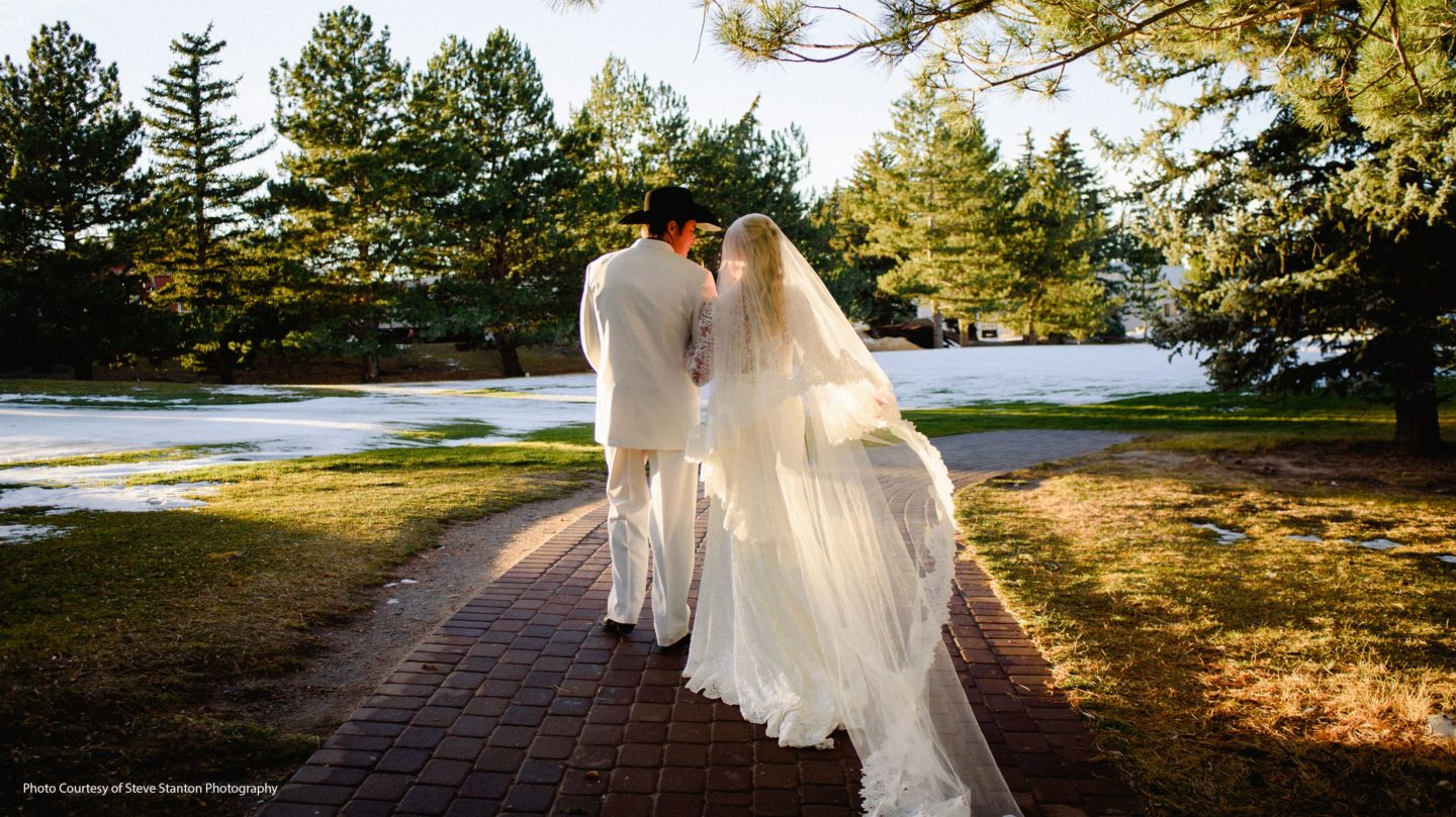 Bride and groom walking on the beautiful winter landscape at the Little America Hotel in Cheyenne.