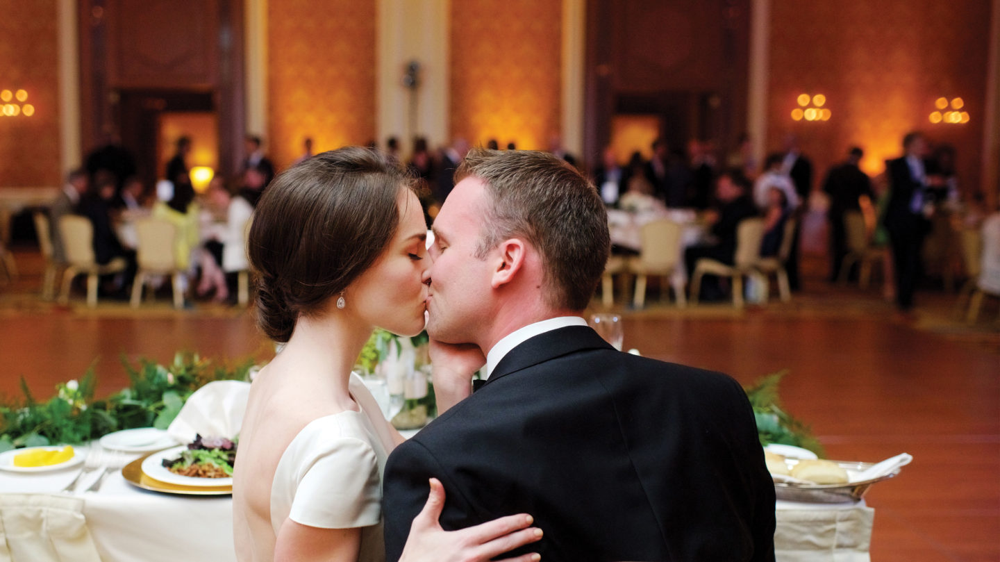Couple kissing at their wedding at Little America Cheyenne in Wyoming.