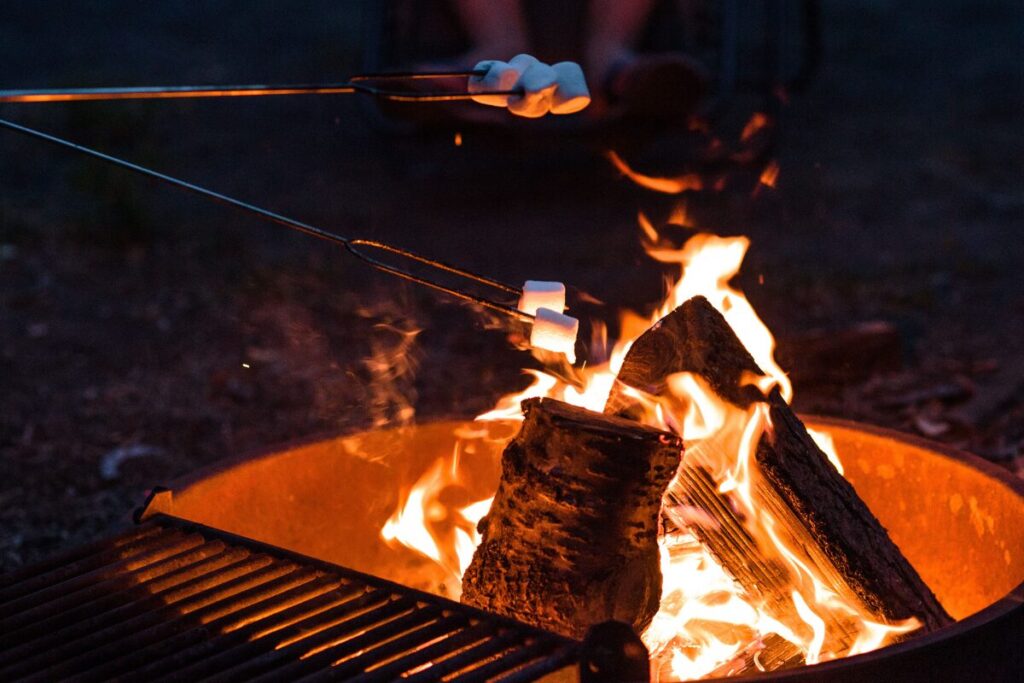 Roasting marchmallwos at a fire pit